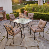 Hanover Outdoor Dining Set Hanover - 5 Piece Dining Set | 4 steel dining chairs w/cushions | 38" sq glass table | PALMBAYDN5PC-TAN