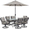 Hanover Outdoor Dining Set Hanover Lavallette 7-Piece Dining Set in Silver Linings with 6 Swivel Rockers, 66" x 38" Glass-Top Table, Umbrella, and Base - LAVDN7PCSW-SLV-SU