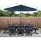 Hanover Outdoor Dining Set Montclair 9 piece Outdoor Dining Set | 8 Swivel Rockers, 42"x 84" Dining Table, Umbrella & Base - Navy and Brown