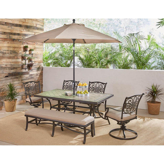 Hanover Table Umbrellas Hanover - Monaco 6-Piece Dining Set in Tan with 4 Swivel Rockers, 1 Bench, a 40" x 68" Tile-Top Table, and a 9 Ft. Umbrella with Stand