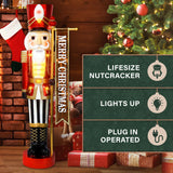 Fraser Hill Farm - 4-Ft. Metallic Nutcracker Holding Banner Statue with LED Lights - Multi