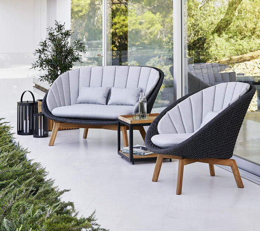 Cane-Line Denmark Conversation Set Cane-Line Peacock Conversation Set | 2-Seat Sofa with Teak Legs and Cushion | 2 Peacock Lounge Chairs | 5558RODGT