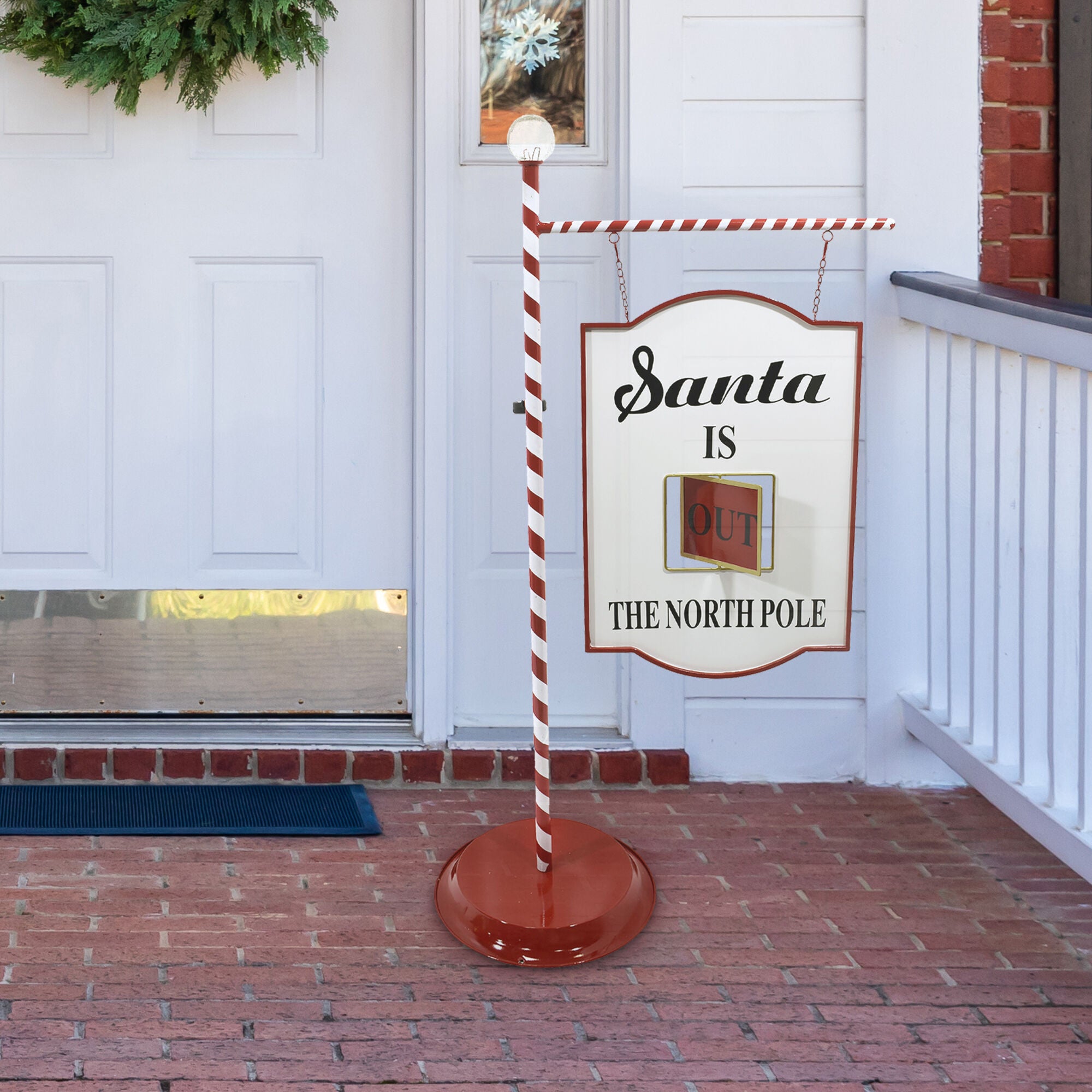 Fraser Hill Farm -  4.5-Ft. Lamp Post with Santa Claus North Pole Sign and Solar Finial, Prelit Outdoor (or Indoor) Christmas Decoration