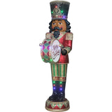 Fraser Hill Farm -  6-Ft. African American Christmas Nutcracker Playing Bass Drum w/ Moving Hands, Music, Timer, and 32 LED Lights