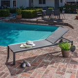 Hanover Chaise Lounge Hanover- Windham 3-Piece Chaise Lounge Set featuring a 40,000 BTU Tile-Top Fire Pit Table with Burner Cover, Gray Frame / Gray Sling | 25x30 | WINDCHS3PCFP-GRY
