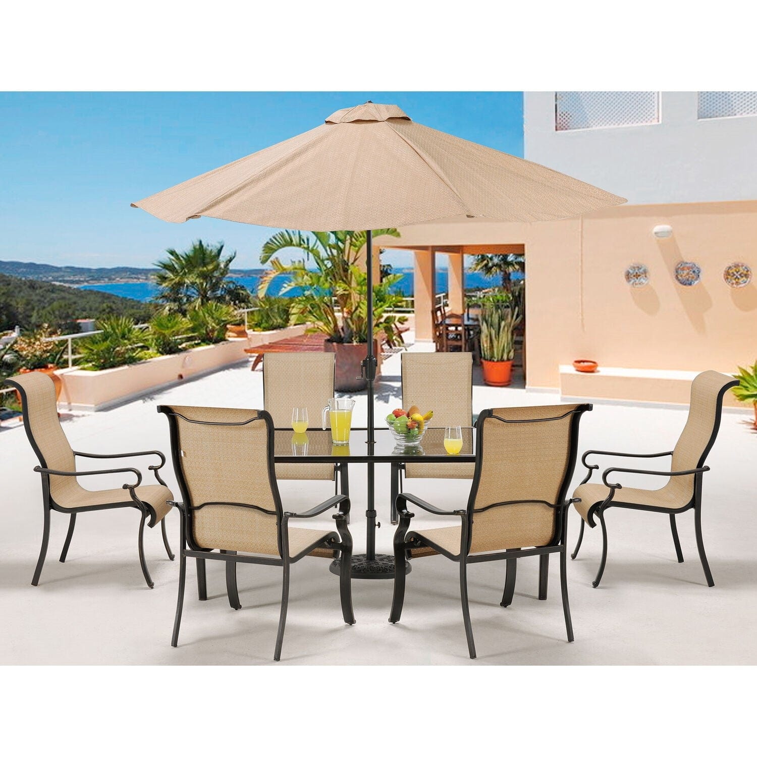 Hanover Outdoor Dining Set Hanover Brigantine 7 Piece Outdoor Dining Set with Glass-Top Table and 9 Ft. Umbrella | Tan/Cast Aluminum | BRIGDN7PC-GLS-SU