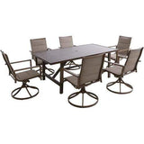 Hanover Outdoor Dining Set Hanover - Fairhope 7-Piece Outdoor Dining Set with 6 Padded Contoured-Sling Swivel Rockers and a 74-In. x 40-In. Trestle Table, Tan
