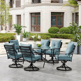 Hanover Outdoor Dining Set Hanover Lavallette 7-Piece Dining Set in Ocean Blue with 6 Swivel Rockers and a 66" x 38" Glass-Top Table