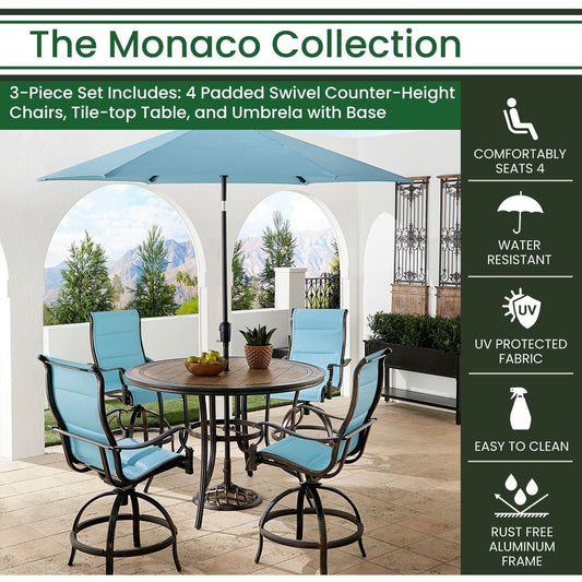 Hanover Outdoor Dining Set Hanover Monaco 5-Piece High-Dining Set in Blue with 4 Padded Counter-Height Swivel Chairs, 56-In. Tile-Top Table and 9-Ft. Umbrella