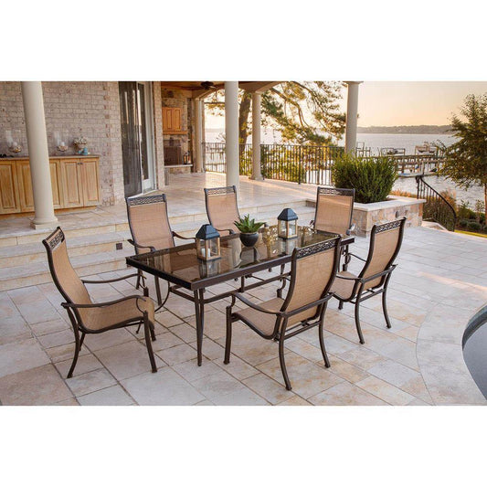 Hanover Outdoor Dining Set Hanover - Monaco 7-Piece Dining Set with Six Sling-back Dining Chairs and One Extra Large Glass-top Dining Table