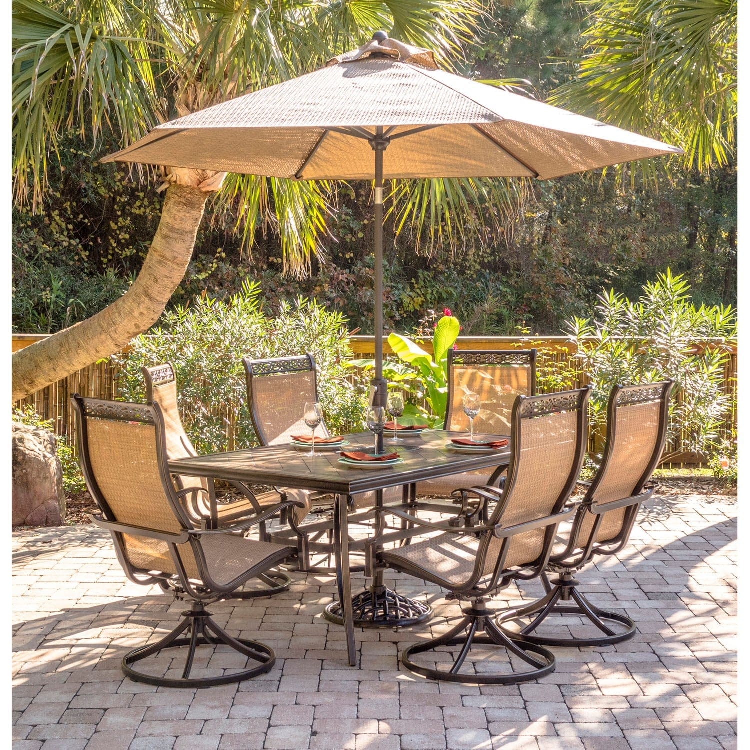 Hanover Outdoor Dining Set Hanover Monaco 7-Piece Dining Set with Six Swivel Rockers, a 68 x 40 in. Dining Table, 9 Ft. Table Umbrella, and Umbrella Stand | MONDN7PCSW6-SU