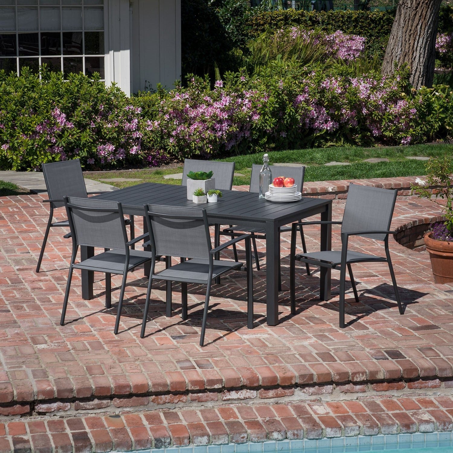 Hanover Outdoor Dining Set Hanover Naples 7-Piece Outdoor Dining Set with 6 Sling Chairs in Gray and a 63" x 35" Dining Table