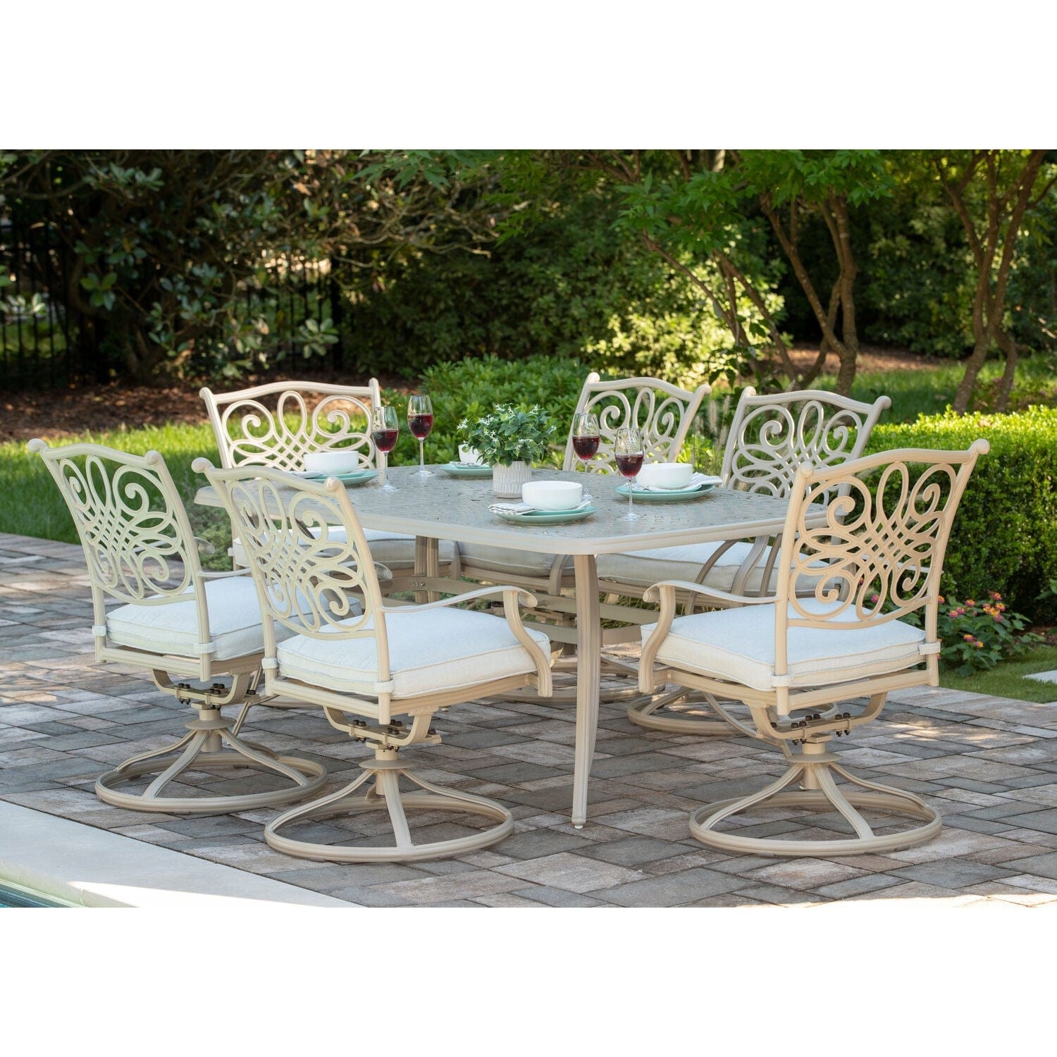 Hanover Outdoor Dining Set Hanover - Traditions 7-Piece Aluminum Frame Dining Set with 6 Swivel Rockers and 38-in. x 72-in. Cast-top Table in Sand Finish | TRADDNSD7PCSW6-BE