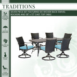 Hanover Outdoor Dining Set Hanover - Traditions 7-Piece Dining Set in Blue with 6 Wicker Back Swivel Rockers and Large 38 in. x 72 in. Cast-Top Table - TRADDNWB7PCSWC-BLU