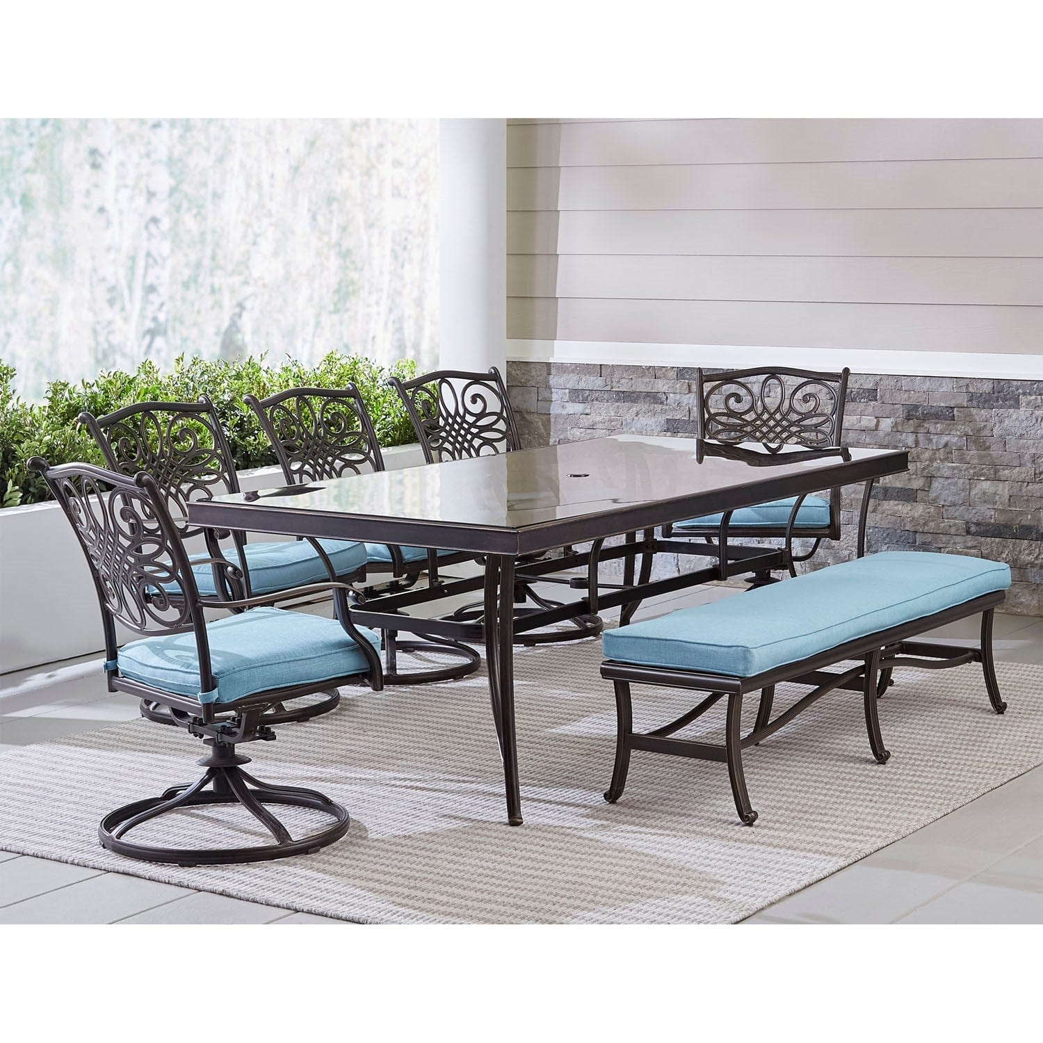Hanover Outdoor Dining Set Hanover - Traditions 7-Piece Outdoor Dining Set in Blue with 5 Swivel Rockers, a Cushioned Bench, and a 42" x 84" Glass-Top Table - TRADDN7PCSW5GBN-BLU