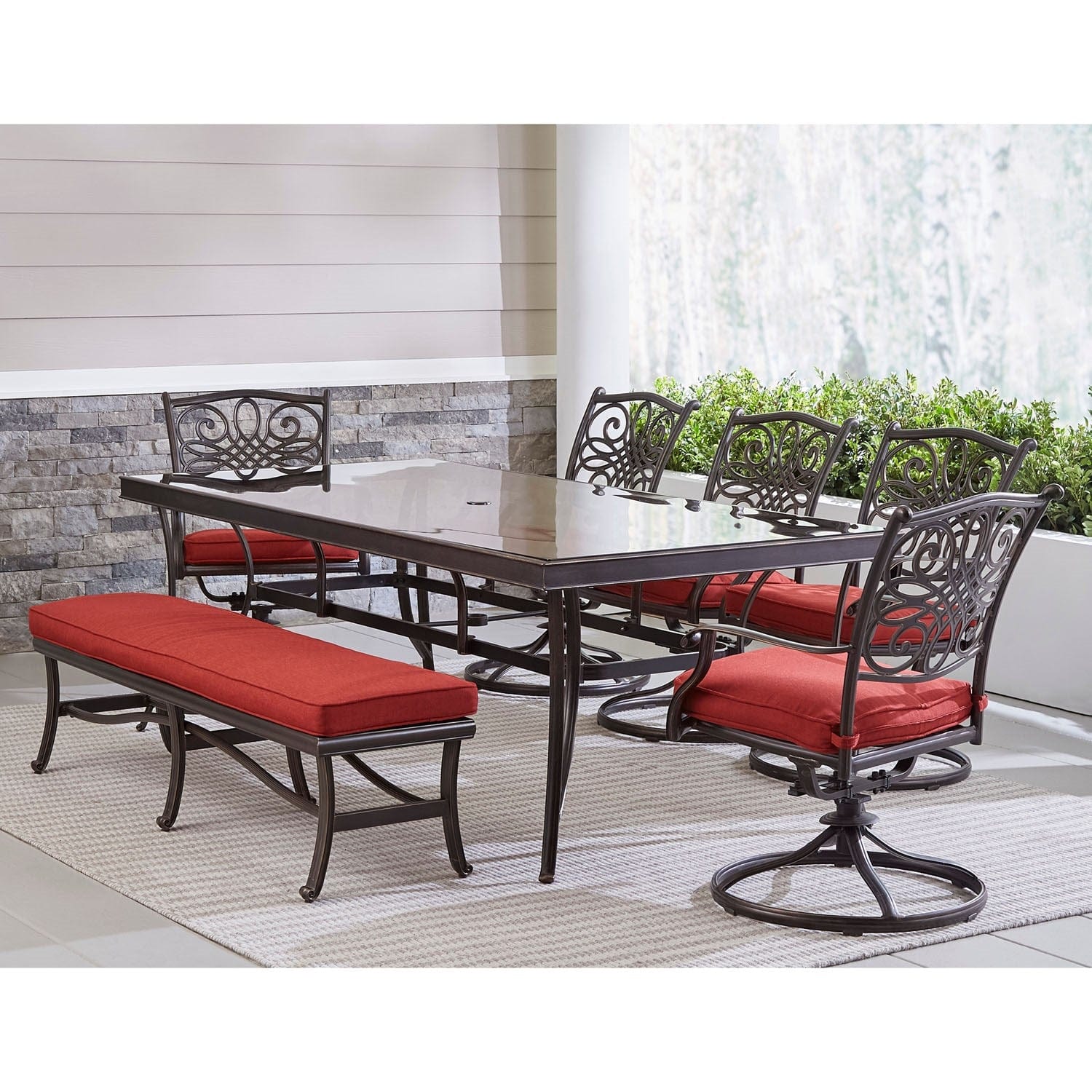 Hanover Outdoor Dining Set Hanover - Traditions 7-Piece Outdoor Dining Set in Red with 5 Swivel Rockers, a Cushioned Bench, and a 42" x 84" Glass-Top Table - TRADDN7PCSW5GBN-RED