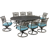 Hanover Outdoor Dining Set Hanover Traditions 9-Piece Dining Set in Blue with 8 Swivel Rockers and 95-in. x 60-in. Oval Cast-Top Dining Table