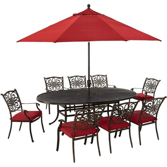 Hanover Outdoor Dining Set Hanover Traditions 9-Piece Dining Set in Red with 8 Dining Chairs, 95-in. x 60-in. Oval Cast-Top Table, Umbrella and Stand