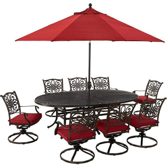 Hanover Outdoor Dining Set Hanover Traditions 9-Piece Dining Set in Red with 8 Swivel Rockers, 95-in. x 60-in. Oval Cast-Top Table, Umbrella and Umbrella Stand