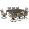 Hanover Outdoor Dining Set Hanover Traditions 9-Piece Dining Set in Tan with 8 Swivel Rockers and 95-in. x 60-in. Oval Cast-Top Dining Table