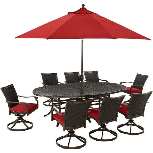 Hanover Outdoor Dining Set Hanover Traditions 9-Piece Set in Red with 8 Wicker Back Swivel Rockers, 95-in. x 60-in. Oval Cast Dining Table, Umbrella and Stand