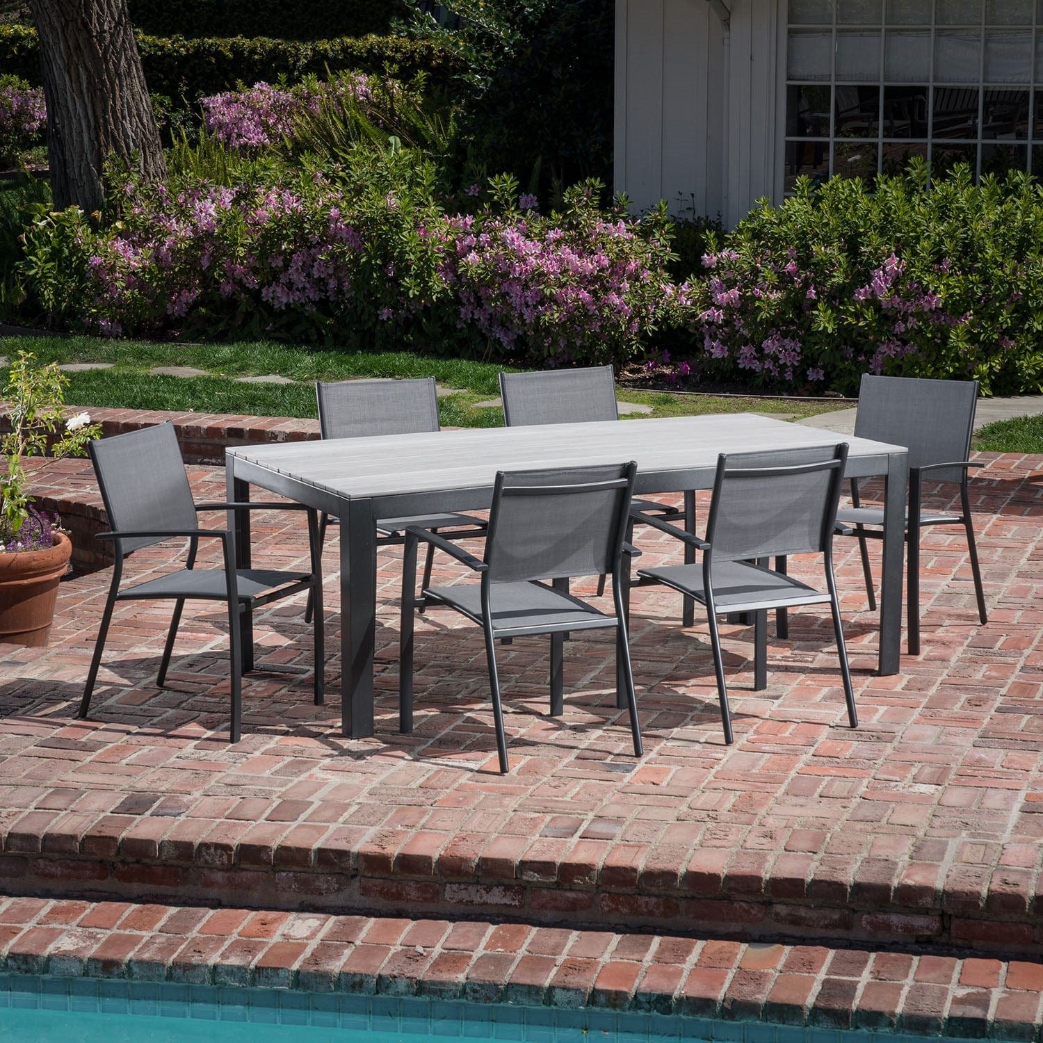 Hanover Outdoor Dining Set Hanover Tucson 7-Piece Aluminium Frame Dining Set with 6 Sling Arm Chairs and a Faux Wood Dining Table | TUCSDN7PC-GRY