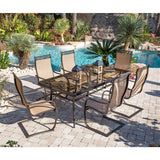 Hanover - Monaco 7-piece Outdoor Dining Set with 6 Sling Spring Chairs with a 42 x 84-In. Glass Top Table - Tan - MONDN7PCSPG